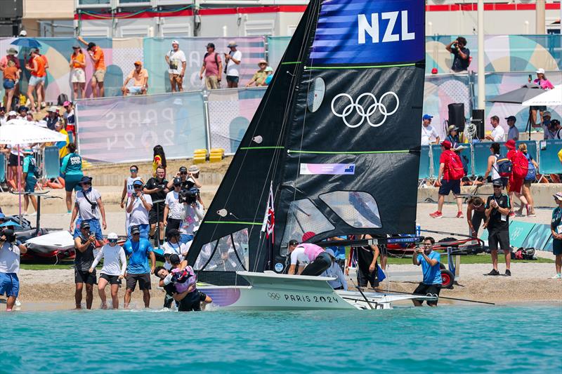 Silver medalists - Isaac McHardie and Will McKenzie (NZL) arrive on tghe beach - Mens Skiff - Paris2024 Olympic Sailing Event - Marseille - August 2, 2024 - photo © World Sailing / Lloyd Images