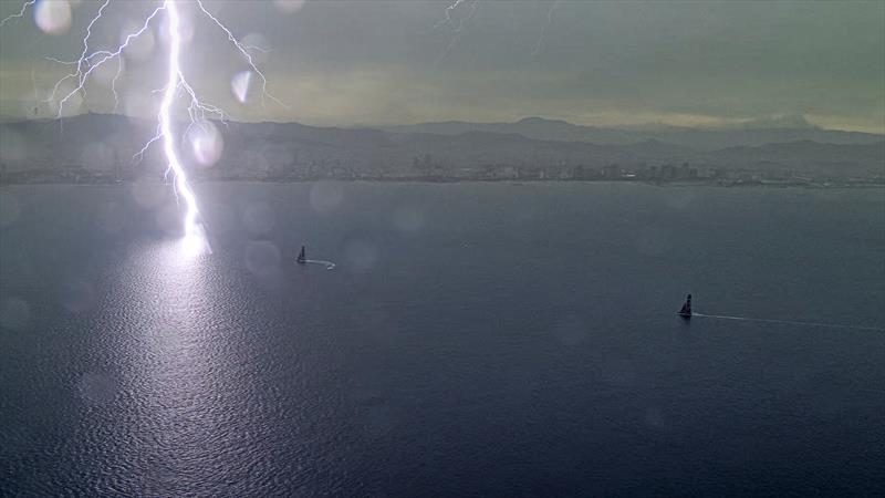 A lightning bolt hits close to Luna Rossa Prada Pirelli and Emirates Team New Zealand on Louis Vuitton Cup Round Robin Day 5 - photo © America's Cup TV