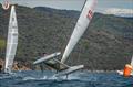 A Class Cat Worlds at Punta Ala - Ian Rodger, ARG 666, appears totally unconcerned that his boat is rather loose at the top mark in 22 kts © Gordon Upton / www.guppypix.com