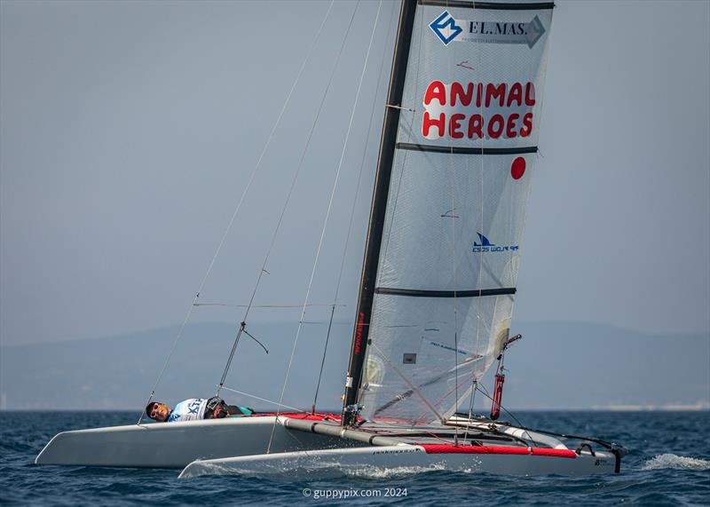 A Class Cat Regata Nazionale - Italian sailor Marco Puppio gets low on his Classic old DNA - photo © Gordon Upton / www.guppypix.com