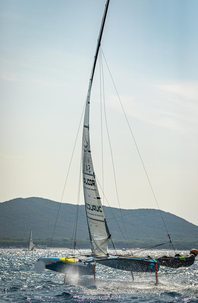 A Class Cat Regata Nazionale - The DN rig in action.  Based on the DN Ice yacht rig, it is designed to control upwind power more efficiently photo copyright Gordon Upton / www.guppypix.com taken at Centro Velico Punta Ala and featuring the A Class Catamaran class