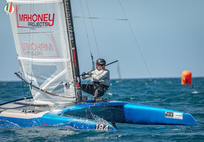 US Champ Bruce Mahoney is having a good regatta - A Class Cat Worlds at Punta Ala day 2 - photo © Gordon Upton / www.guppypix.com