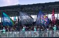 Spectators watch from the grandstand in the race stadium as team flags are paraded by on Race Day 1 of the Emirates Dubai Sail Grand Prix © Felix Diemer/SailGP