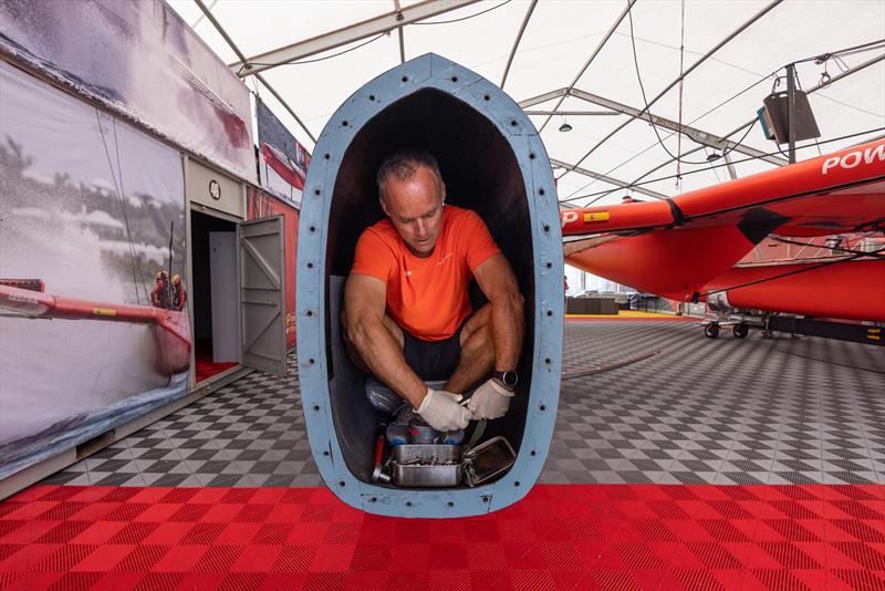 A member of the SailGP Technical team prepares the bow of the Spain SailGP Team F50 catamaran in the teams hangar at the Technical Base ahead of the  Denmark Sail Grand Prix in Copenhagen, Denmark. 16th August  - photo © David Gray/SailGP