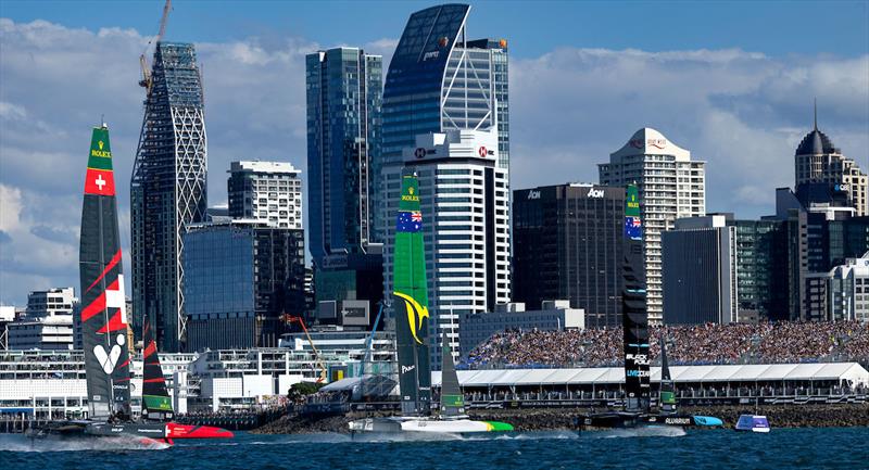 Switzerland SailGP Team helmed by Sebastien Schneiter, Australia SailGP Team helmed by Tom Slingsby and New Zealand SailGP Team helmed by Peter Burling sail past spectators in the grandstand on Race Day 1 - photo © Felix Diemer for SailGP