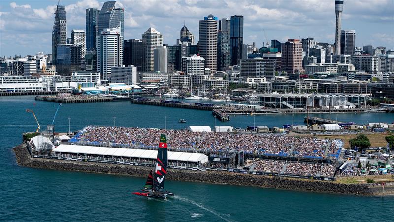 Switzerland SailGP Team helmed by Sebastien Schneiter sails past the spectators watching from the grandstands on Race Day 1 of The Rolex SailGP Championship ITM New Zealand Sail Grand Prix in Auckland, New Zealand photo copyright Bob Martin for SailGP taken at  and featuring the F50 class