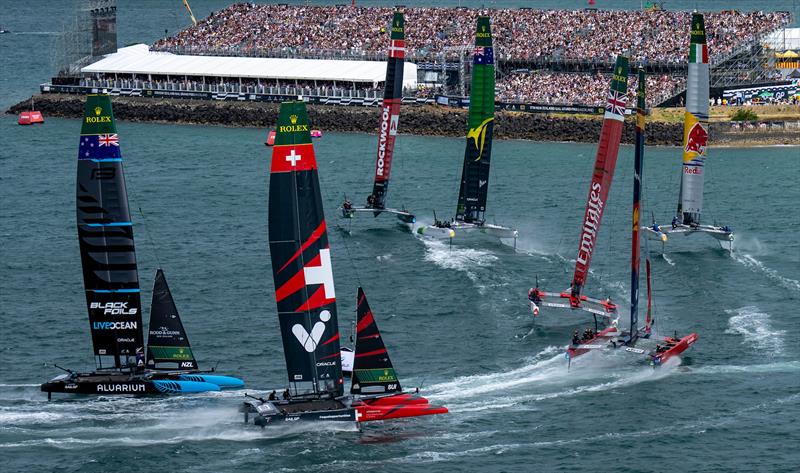 Teams round the finish marker in front of the grandstand full of spectators on Race Day 2 of The Rolex SailGP Championship ITM New Zealand Sail Grand Prix in Auckland photo copyright Bob Martin for SailGP taken at  and featuring the F50 class