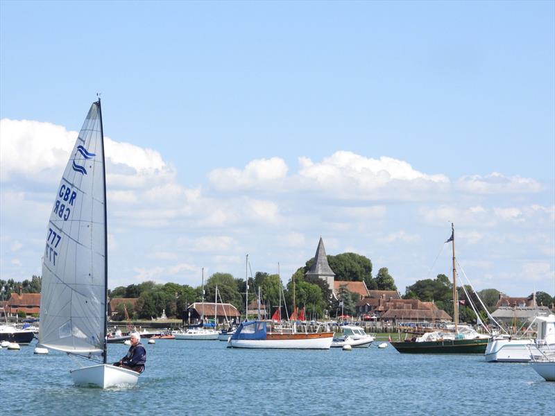 Howard Sellars (Warsash SC) leaves the slipway with the picturesque village of Bosham in the background during the Bosham Finn Open 2024 photo copyright Greg Grant taken at Bosham Sailing Club and featuring the Finn class