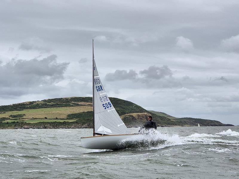 Club Commodore Scott McColm on the crest of a wave at some speed in his Finn during Kippford Week photo copyright Richard Bishop taken at Solway Yacht Club and featuring the Finn class