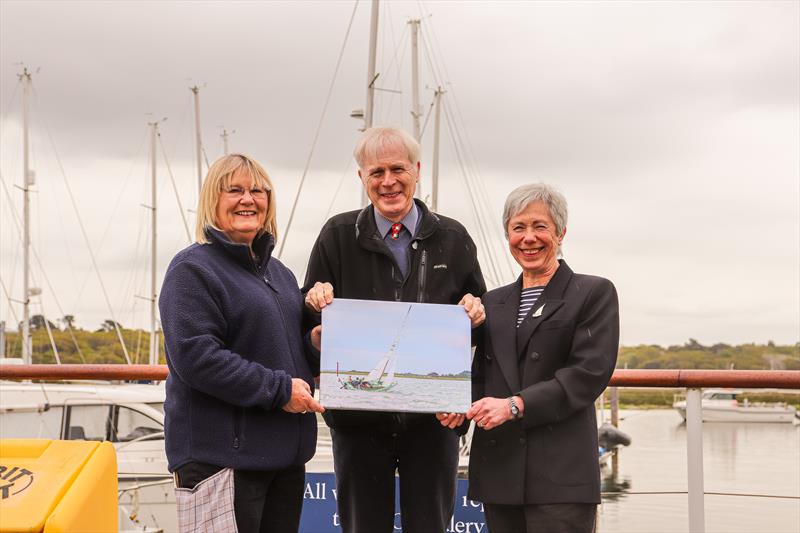 (l-r) Winner Maggie White with Lord Montagu and boat owner Joanne Husband with the print - photo © Jane Riddiford