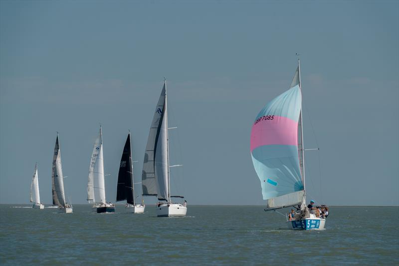 707 sails ahead of the class 6 boats during Burnham Week 2024 photo copyright Petru Balau Sports Photography / sports.hub47.com taken at Royal Corinthian Yacht Club, Burnham and featuring the 707 class