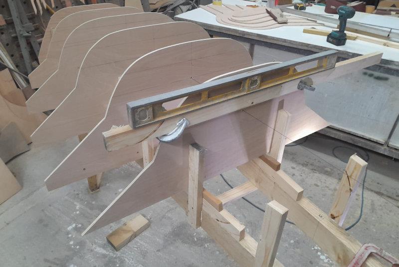 When creating a plug, a lot happens early on - the hull shape formers (one per foot of hull length) are cut out and mounted onto a frame, which is then battened photo copyright Dougal Henshall taken at  and featuring the International Moth class