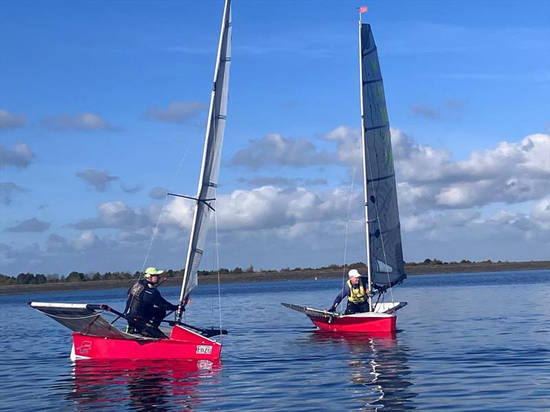 Paul Hignett ghosts past Graham Hughes during the International Moth Lowriders `Burton Rinse Cycle` Inlands photo copyright Paul Kelly taken at Burton Sailing Club and featuring the International Moth class