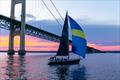 Boat and bridge at sunset in the CYC Race to Mackinac © scastphoto