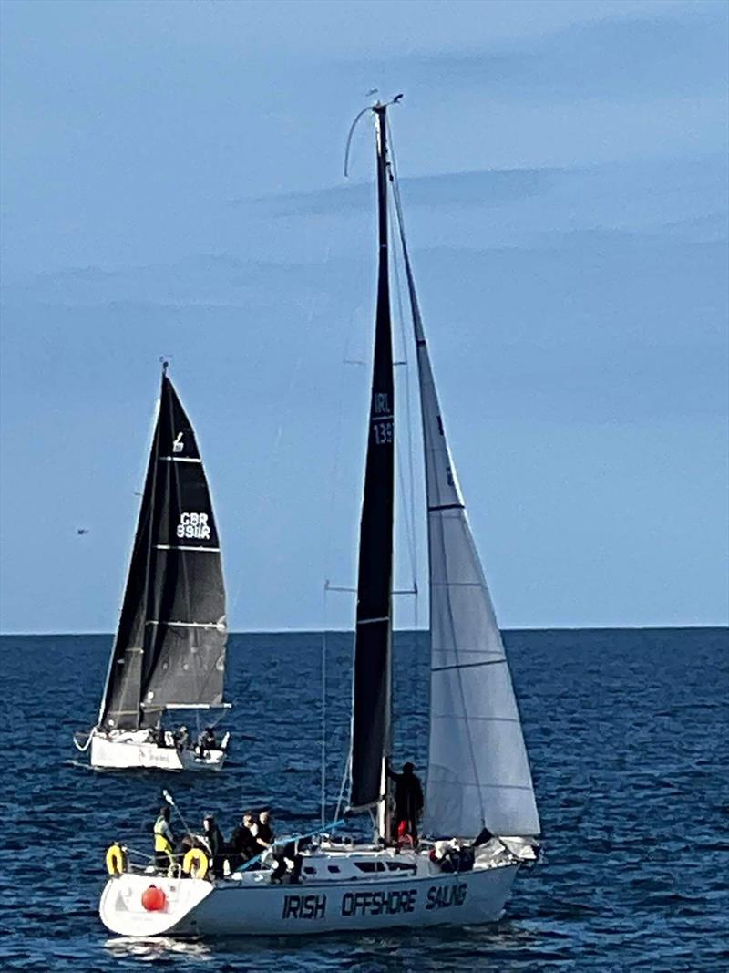 Musto ISORA race from Pwllheli to Dun Laoghaire - Jezebel and visiting boat Desert Star from Dun Laoghaire, Ireland at the start photo copyright Michelle Jones taken at Pwllheli Sailing Club and featuring the IRC class