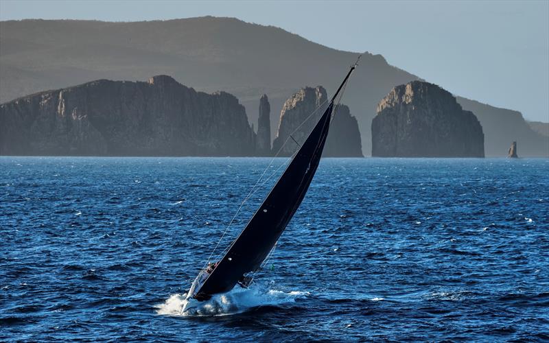 Indigo II negotiates the passage close to Cape Hauy and the lanterns in the Tasman National Park photo copyright Carlo Borlenghi / ROLEX taken at Cruising Yacht Club of Australia and featuring the IRC class