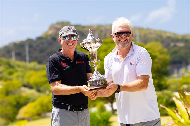 Volvo 70 Tschüss 2 (USA) is the winner of the 2025 RORC Caribbean 600. Owner Christian Zugel & Johnny Mordaunt with the RORC Caribbean 600 Trophy  photo copyright Arthur Daniel / RORC taken at Royal Ocean Racing Club and featuring the IRC class