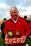 Brass Monkey Christmas race at Abbey Meads - a delighted Phil Holliday collecting his prize and the Brass Monkey © Roger Stollery