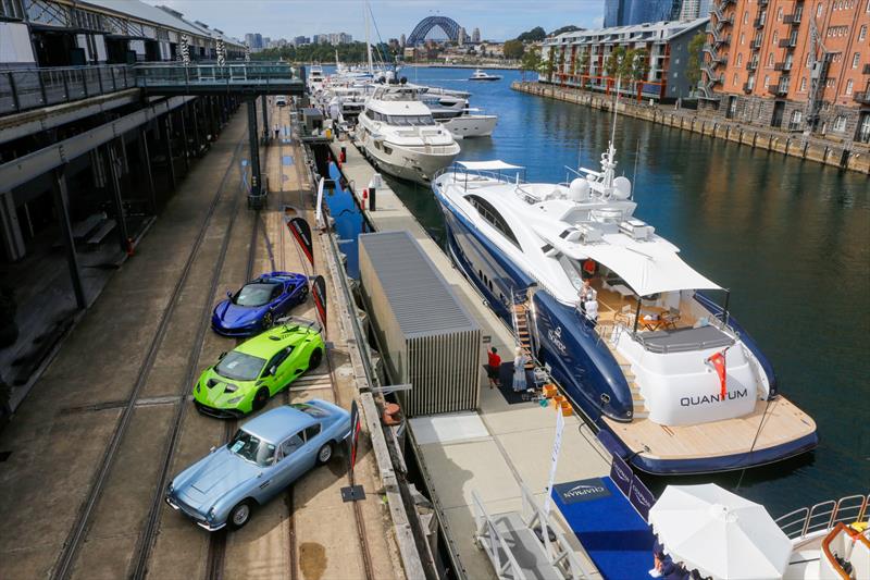 Luxury yachts and vehicles line the docks - photo © Salty Dingo