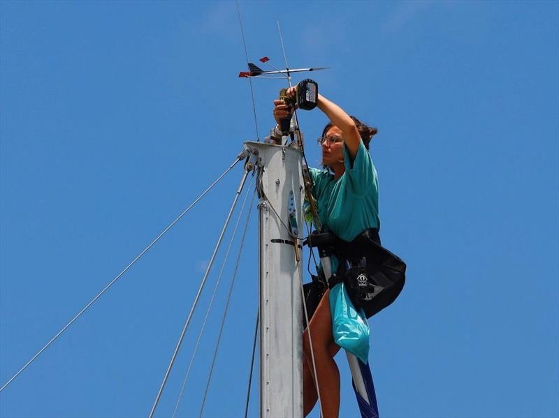 Ambre working in a boatyard at the top of a rig - photo © Ambre Hasson