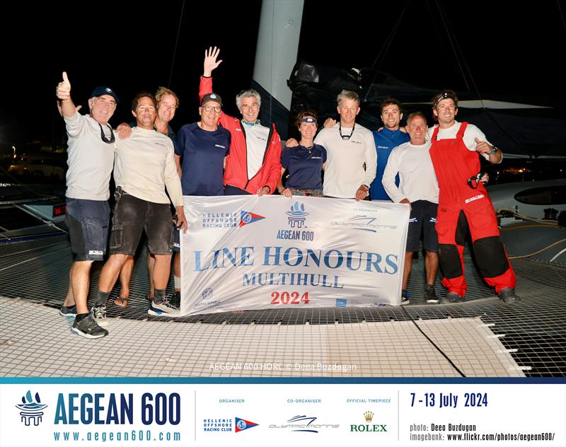 The line honours-winning Zoulou crew of Erik Maris (centre with arm raised), including French multihull legend Loick Peyron (far left) and Britain Ned Collier Wakefield (far right) - photo © Deea Buzdugan