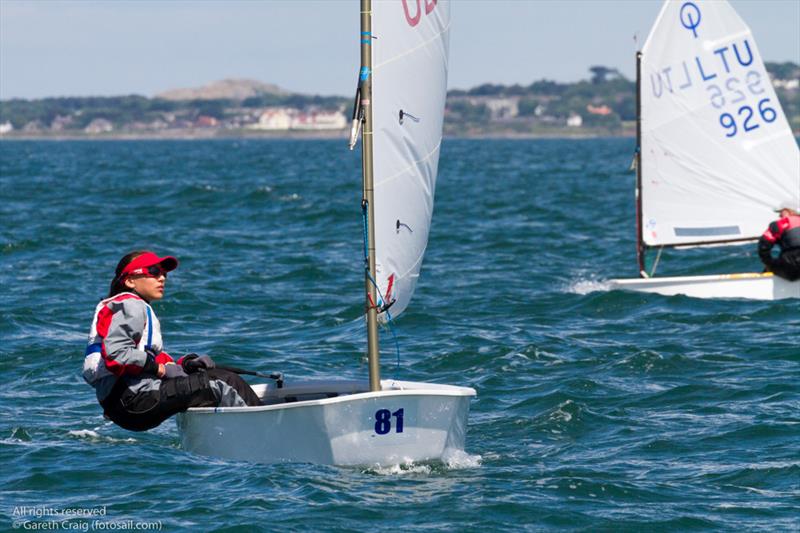 Ebru Bolat (ROU 899) on the fifth day of the Optimist European Championships on Dublin Bay photo copyright Gareth Craig / www.fotosail.com taken at Royal St George Yacht Club and featuring the Optimist class