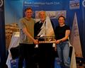 Edwin Buckley (event director and race officer) presents Oliver Groves and Esther Parkhurst with the Endeavour Trophy © Roger Mant Photography