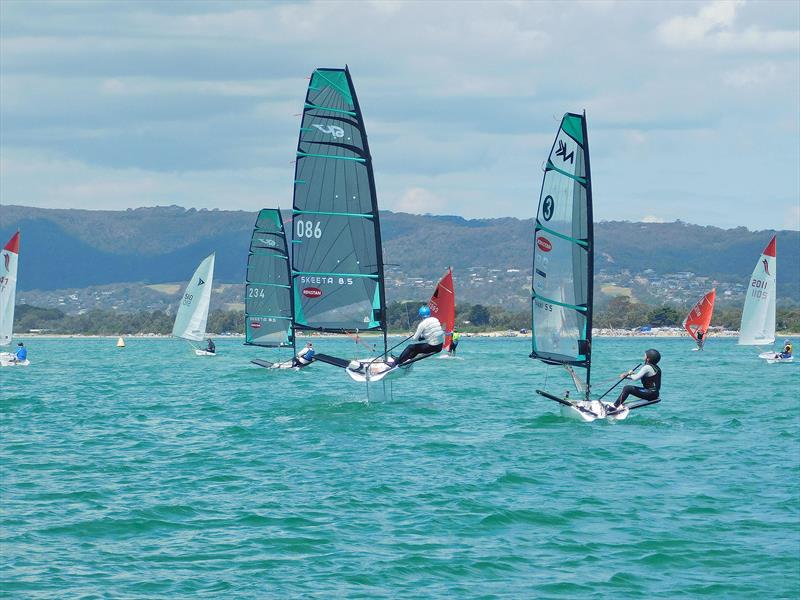 David French on the Skeeta with 13 year old Acklin Stent in hot pursuit on the Nikki - photo © Capel Sound Invitational