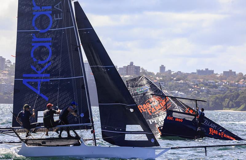 Winnings 2025 JJ Giltinan 18ft Skiff Championship Invitation Race: NZ's Akarana Eatery passes a capsized Rag and Famish Hotel - photo © SailMedia