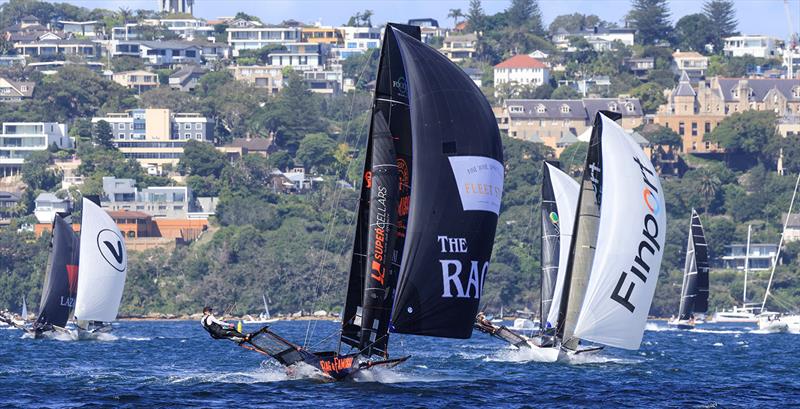 Winnings 2025 JJ Giltinan 18ft Skiff Championship Race 2: The Rag & Famish Hotel power downwind ahead of Finport Finance - photo © SailMedia