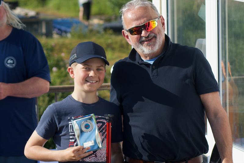 Eastern Area 4.2 Topper Championship Trophy presented to Toby Hailey (WOBYC) presented by Adrian Tebbutt, Commodore SBSC, Topper Eastern Area Championships at Snettisham Beach photo copyright John Blackman Northwood taken at Snettisham Beach Sailing Club and featuring the Topper 4.2 class